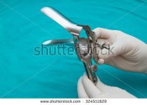 stock-photo-doctor-holds-a-disposable-speculum-in-his-hand-324511829.jpeg