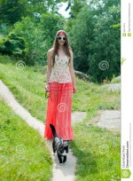 woman-walking-black-cat-lead-25511513.jpg