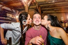 graphicstock-two-young-beautiful-women-kissing-man-in-bar-or-club-having-fun_B_5gGuHMZ_SB_PM.jpg