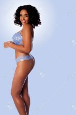 95450234-beautiful-happy-sexy-woman-with-curly-hair-in-light-blue-lingerie-bra-and-thong-.jpg