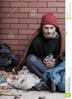 poor-homeless-man-street-sitting-40996456.jpg