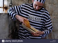 prisoner-in-a-cell-with-file-hidden-inside-a-cake-england-uk-G0T1K8.jpg