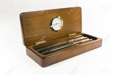 12761669-a-pencil-box-with-a-clock.jpg