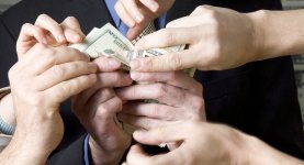 people-grabbing-money-from-businessman-mid-section-close-up-2.jpg