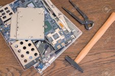 45728568-Bad-computer-repair-broken-old-computer-or-laptop-with-hammer-and-pliers--Stock-Photo.jpg