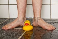 6035446-feet-of-boy-in-shower-with-a-lonely-rubber-duck.jpg