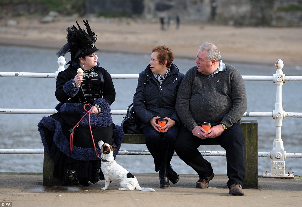 1414980763216_wps_80_People_sit_along_the_prom.jpg