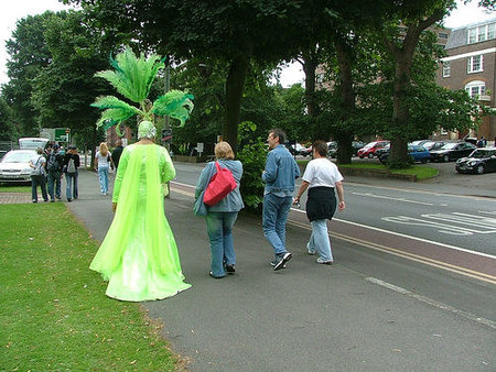 man-in-green-outfit-walking-with-people.jpg