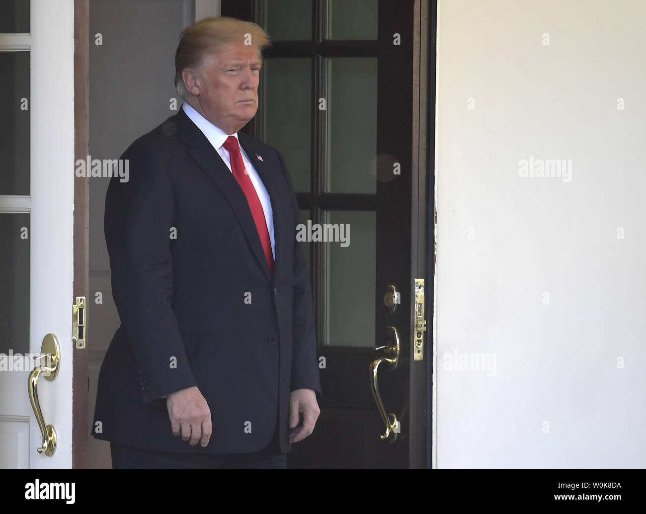 president-donald-trump-waits-in-the-doorway-to-the-west-wing-for-the-arrival-of-chiles-president-sebastian-pinera-to-the-white-house-september-28-2018-in-washington-dc-pinera-who-served-as-president-four-years-ago-is-a-billionaire-entrepreneur-and-will-be-discussing-chiles-slumping-economy-with-trump-photo-by-mike-theilerupi-W0K8DA.jpg