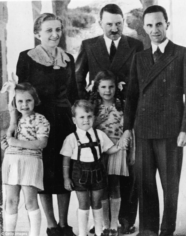 Adolf-Hitler-stands-with-Goebbels-his-wife-Magda-and-their-three-oldest-children-left-to-right-Hilda-Helmut-and-Helga.-daily-mail.jpg