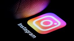 BERLIN, GERMANY - OCTOBER 06: In this photo illustration the Logo of Instagram is illuminated on a smartphone close to a finger on October 06, 2023 in Berlin, Germany. (Photo Illustration by Thomas Trutschel/Photothek via Getty Images)